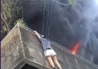 HEROÍNA FILIPINA SALVA CÃES DE INCÊNDIO AO ARREMESSÁ-LOS DO TERCEIRO ANDAR